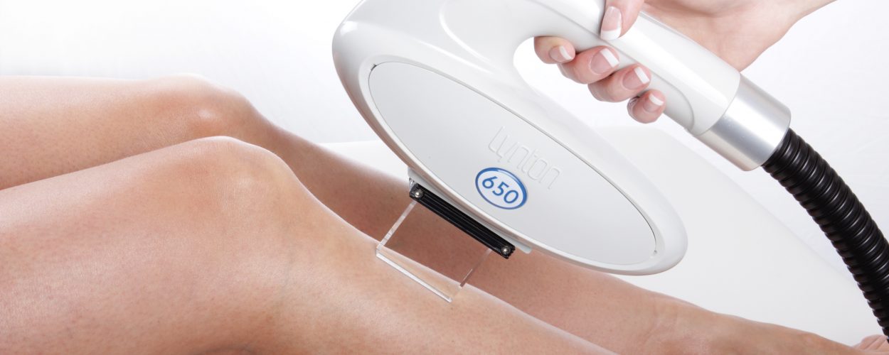 Hair Removal Machine - hand piece in use